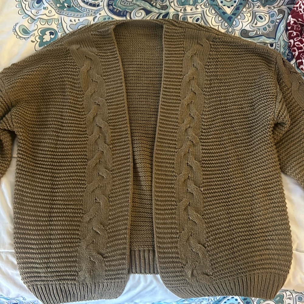 Brand new sweater, color is a brown or dark taupe color.
